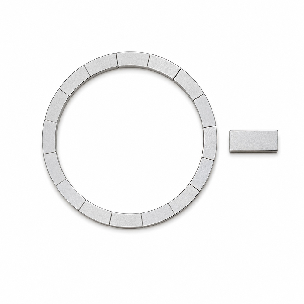 54x46x1 mm N52 neodymium ring magnet and rectangular magnet piece side by side on white background